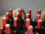 many bottles of wine in a box on the table