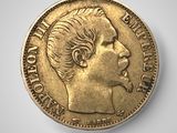a close up of a coin with a woman ' s face on it