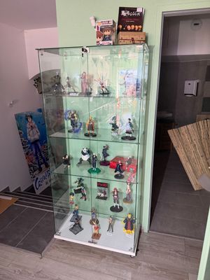 a display case with a lot of figurines on it