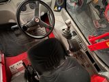a red car with a steering wheel and a dashboard