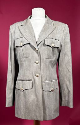an image of a woman ' s jacket on a mannequin