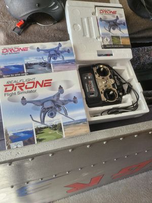 a box with a remote control and a helmet on top of it
