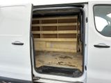 a white van with open doors and shelves in the back of it