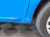 a close up of a tire on a blue car