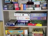 many board games on the shelves in the room