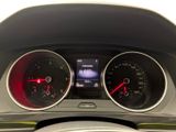 a close up of a car dashboard with various gauges