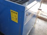 a blue machine that is sitting in the corner of a room