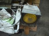 a picture of a traffic light sitting on top of a pile of junk