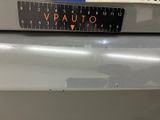 a close up of a calculator on the back of a car