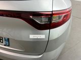 a close up of the rear end of a silver car