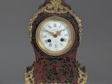 a small clock that is sitting on a table