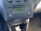 a car dashboard with a clock on it and a gear stick
