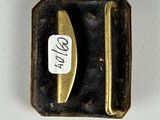 a small metal object with a sticker on it