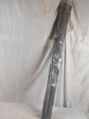 a black umbrella that is wrapped in plastic on a table
