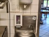an image of a kitchen with a sink and a faucet