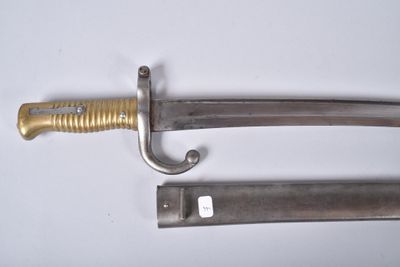 two knives are laying side by side on a white surface