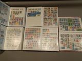 a lot of different stamps on the pages of a book