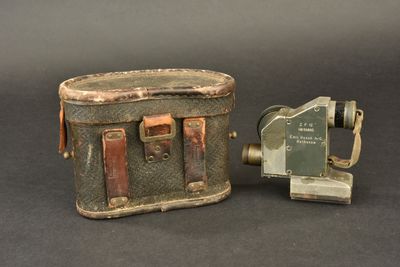 a small suitcase and a small camera on a table