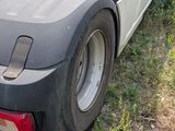 an image of a semi truck parked in the grass