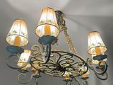 a chandelier with five lamps hanging from it ' s ceiling