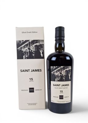 the bottle of saint james is next to a box of wine