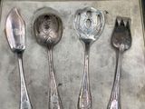 four spoons and two spoon spoons in a box