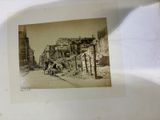 an old picture of a horse and buggy on the street