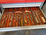 a drawer full of different types of pens and pencils