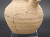 a vase that has a crack in the middle of it