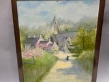 framed oil painting of a country road with a church in the background