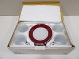 a box with cups and a plate inside of it
