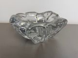 a glass bowl that is sitting on a table