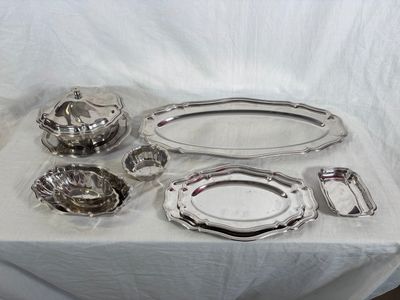 a lot of silver items sitting on a table