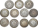 a group of six silver coins with the names of different countries