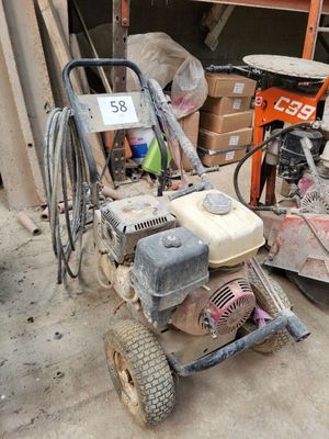 a small machine that is sitting in the middle of a pile of junk