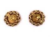 a pair of gold - plated buttons with a cross on them