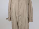 an image of a beige trench coat on a mannequin stand