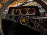 a close up of a steering wheel and dashboard of a car