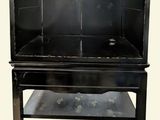 a black cabinet that has a sink in it