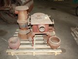 several pots and pans are sitting on a pallet in a warehouse