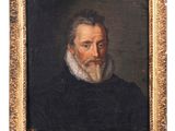 portrait d'un homme barbu vêtu d'un manteau noir et portant une barbe blanche