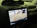 a car that has a monitor on the dashboard