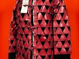 red leather jacket with black and white triangles on a mannequin mannequin mannequin mannequin mannequin mannequin mannequin mann