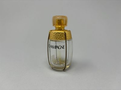 YVES SAINT LAURENT - Champagne Flacon en verre et métal