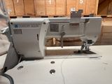 a sewing machine that is sitting on a table