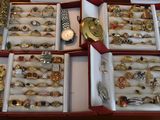 many different types of jewelry in a red case