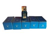 several boxes of perfumes are stacked on top of each other