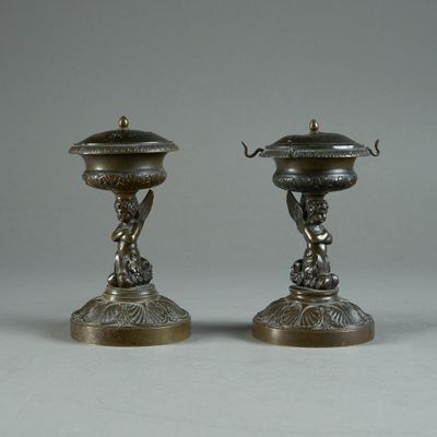 pair of antique silver plated candlesticks with cherensh and cherensh