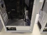 two computer cases sitting on a table in a room