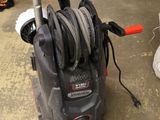 a black and decker vacuum with a hose in it